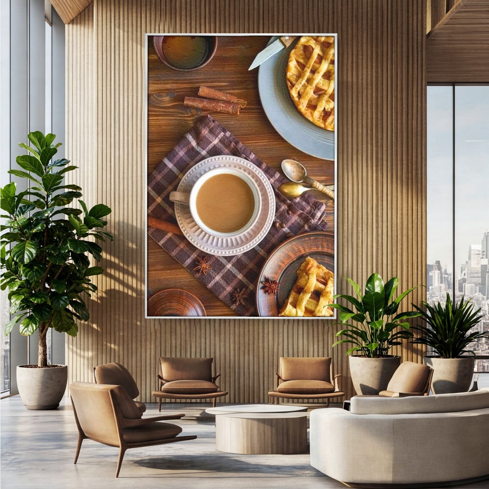 Tablou canvas cu natura moarta cu cafea si placinta, in rama de aluminiu argintiu, pe perete intr-un birou